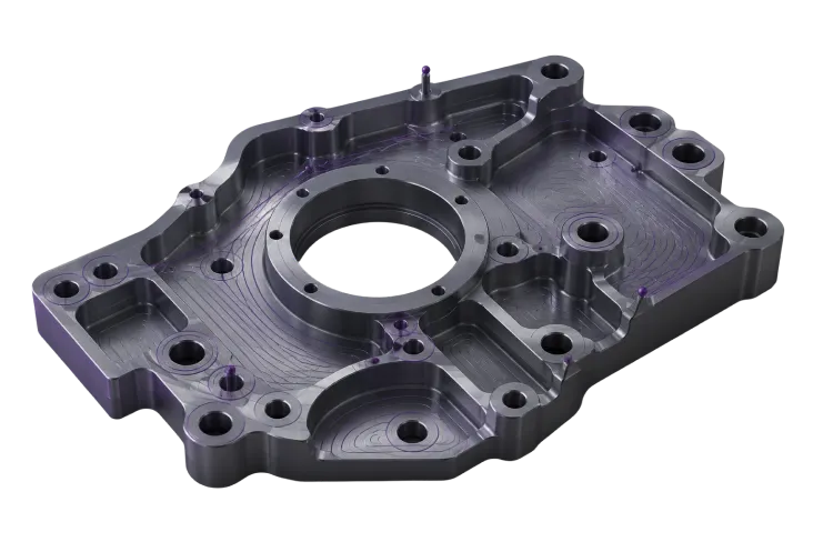 Machined housing with toolpath overlay Machined metal housing covered with purple toolpath contours